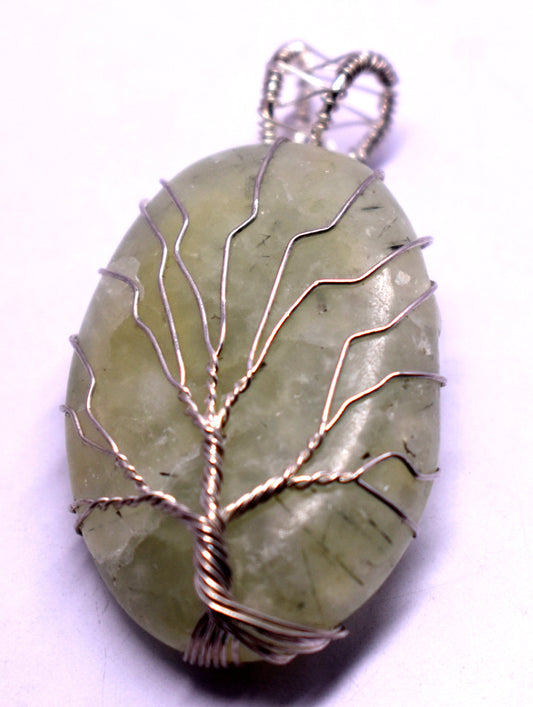 Prehnite wire wrapped pendant for enhancing intuition, emotional healing, and energy balance. Perfect for spiritual growth and protection. Handcrafted crystal jewelry for self-discovery.